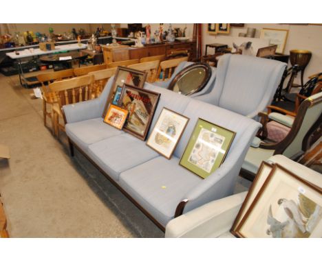 A three piece suite comprising of three seater settee, matching wingback armchair and a standard armchair