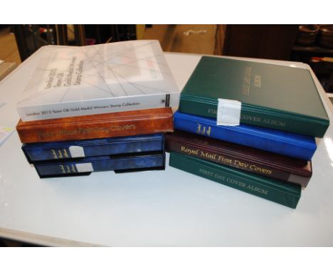 Two boxes containing 19 FDC stamp albums 1980's, 2009 including miniature sheets, regionals, 2012 Olympics etc.