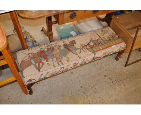 A footstool decorated with the Bayeux Tapestry