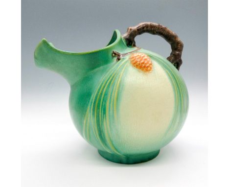Light green coloration, adorned with pinecones on body. Dimensions: 8.25"L x 6.25"W x 7"HCondition: Age related wear. Minor c