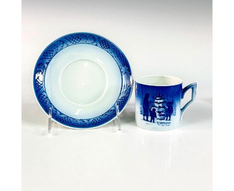 Blue and white image of a father and child selecting a tree. Pine comb design on saucer rim.'Choosing the Christmas Tree' and