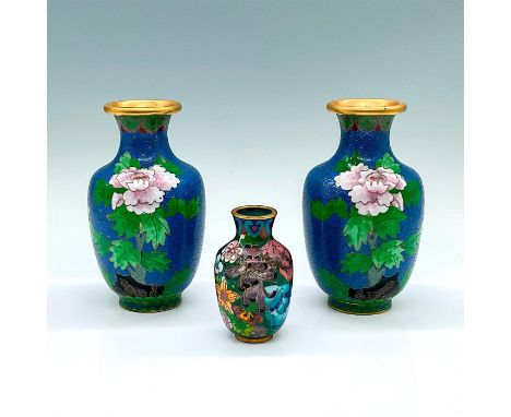 Three beautiful brass vases with colorful enamel flowers. Includes a two matching vases, and one smaller vase. Vase 1: 3"W x 
