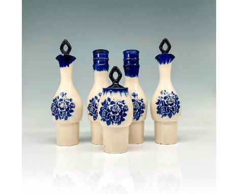 Hand painted ceramic with deep blue glaze and floral pattern. Salt, pepper, oil, vinegar, and mustard bottle largest with dim