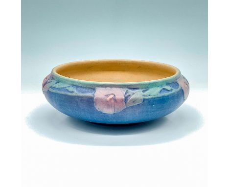 Created by Sadie Irvine under master potter J. Meyer, this stunning blue floral bowl is a remarkable piece that embodies the 