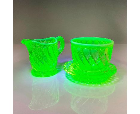 This three-piece set showcases the charm and allure of this distinctive glassware with its yellow swirling pattern and white 