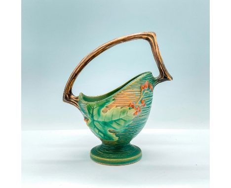 This Roseville Style basket is a stunning ceramic piece that combines a classic basket shape with intricate bushberry pattern