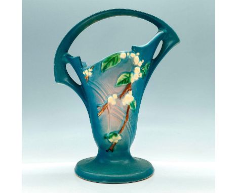 This tall, handled basket is a charming collectible featuring the iconic Snowberry pattern in a serene blue glaze, with vinta