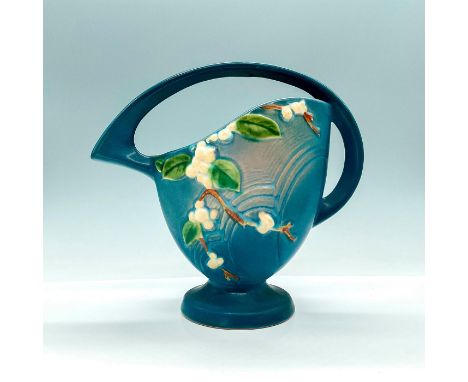 This adorable basket is a charming collectible featuring the iconic Snowberry pattern in a serene blue glaze, capturing a vin