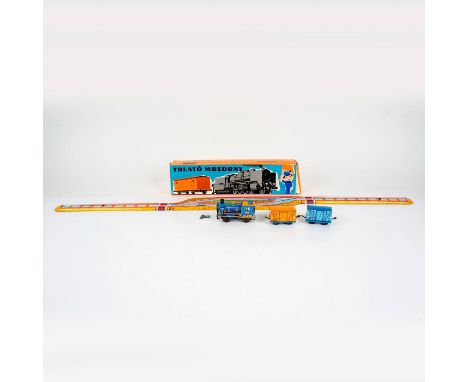 Tin foldable track with engine, and two cars. Includes two wind-up keys. Largest figure 3.75"L x 1.5"W x 2.25"H. This item ha