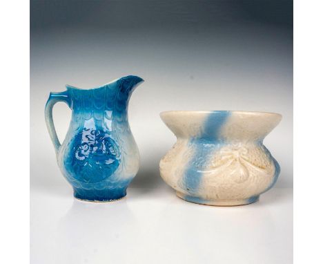 Glazed finish vessels in blue and cream coloration, embossed with ribbons and roses pattern. Spittoon measures: 7.25â€W x 5.2