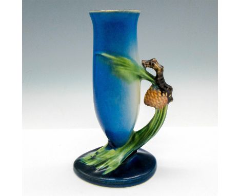 Thin design with pinecone handle with light and dark blue coloration. Roseville Pottery mark. Issued: c. 1931Dimensions: 4.25