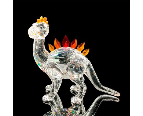 This dinosaur was part of the â€œFairy Talesâ€ collection. The dinosaur has a clear crystal body and his comb and plates are 