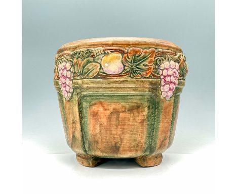 This Weller Pottery jardiniere is a stunning example of American craftsmanship, adorned with a captivating grapes and apples 