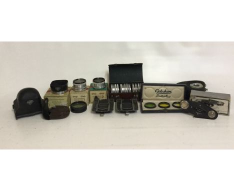 Rollei Various Accessories
Accessories: Includes Tripod Head, Tripod Mounts, Reflex Prism Finder, Close Up Lenses etc
