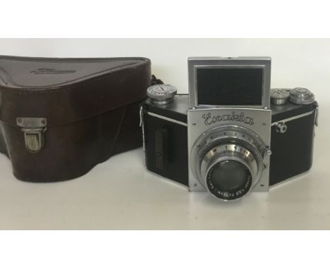 Ihagee Exakta B SLS Camera
Serial No:533040
Lens: 75mm Tessar
Accessories: Leather Case + Flash Adaptor
Age of Item: 1938
