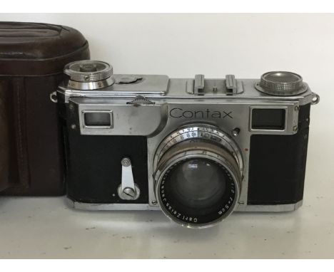 Zeiss Contax IIA Camera
Serial No:C1119
Lens: 50mm Opton F2.0
Accessories: Leather Case
Age of Item: 1954 - 1961
