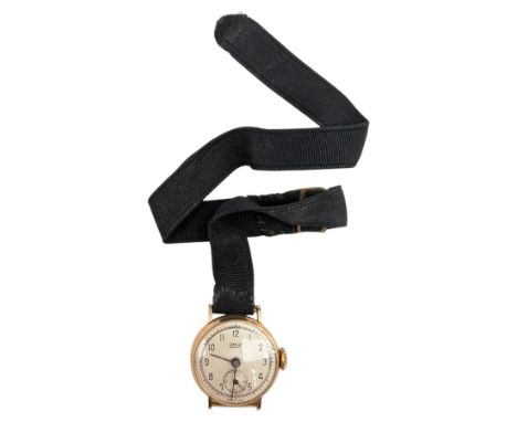 Orly ladies 18ct gold manual wind wristwatch, on black ribbon strapCondition Report:Approx 8.5gm gross (including strap and m