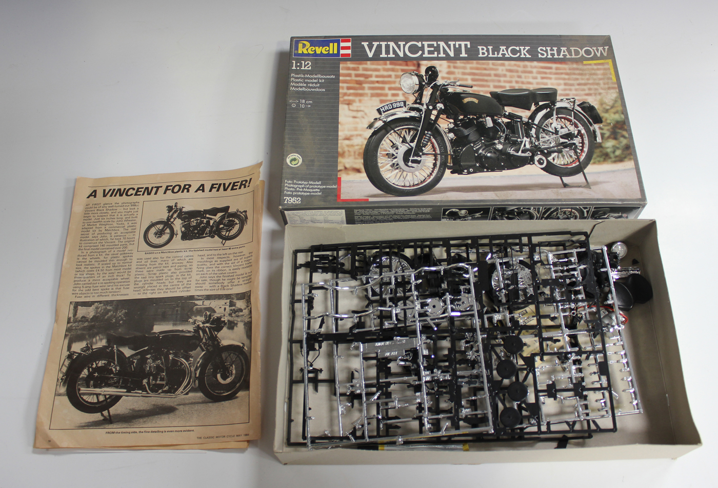 A small collection of plastic model kits, including a Matchbox Vincent