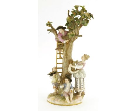 A Meissen fruit-picking group,late 19th century, modelled as a young boy collecting apples, on a ladder balanced against a tr