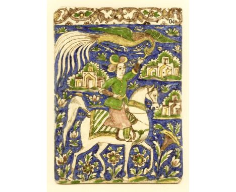 A Persian tile,late 19th century, moulded with a man riding a horse whilst feeding a large exotic bird, restored,25cm wide32c