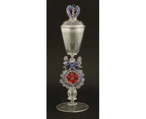A façon de Venise winged wine glass and cover,20th century, the domed cover with a coloured scrolled finial over a round funn
