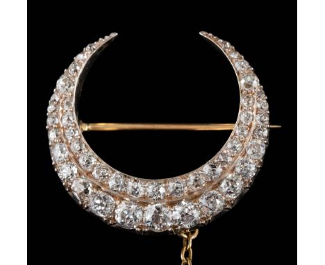 A Victorian diamond mounted two-row crescent brooch: set with graduated round old, brilliant-cut diamonds estimated to weigh 