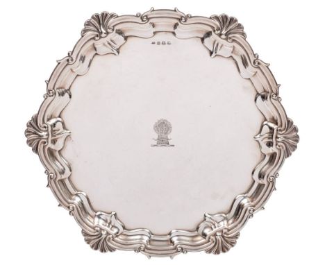 A George V silver salver, maker William Adams Ltd, Birmingham, 1930: crested, of circular outline with foliate and scroll dec