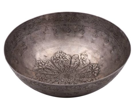 A silver Judaica bowl, unmarked: of shallow circular form with embossed stylised flowerhead decoration to the centre with a s