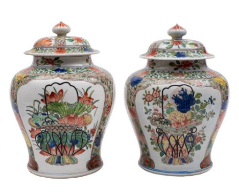 A pair of Samson famille verte baluster vases and covers: decorated in the Kangxi manner with lotus shaped panels of large ja