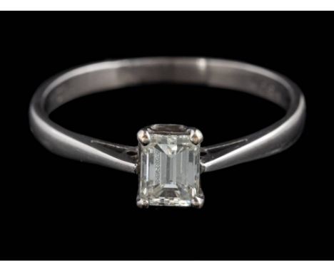 A diamond solitaire ring: the emerald-cut diamond approximately 5.0mm long x 3.9mm wide x 2.9mm deep, estimated to weigh 0.50