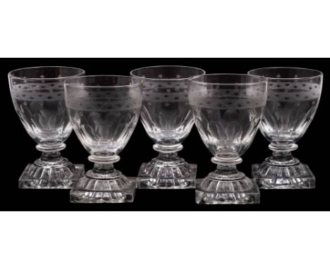 A set of five glass rummers: each bowl with an engraved and frosted band, on knopped stems and lemon squeezer bases, 12.5cm.