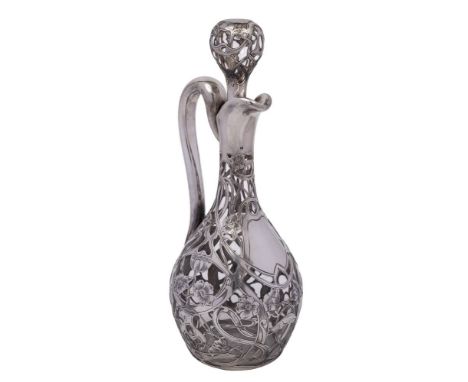 An Art Nouveau period Continental clear glass and silver mounted decanter and stopper: with slender neck and ovoid body with 