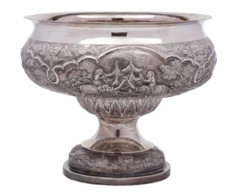 An Indian silver pedestal bowl: with embossed decoration of village scenes with elephants, peasants and oxen within foliate b
