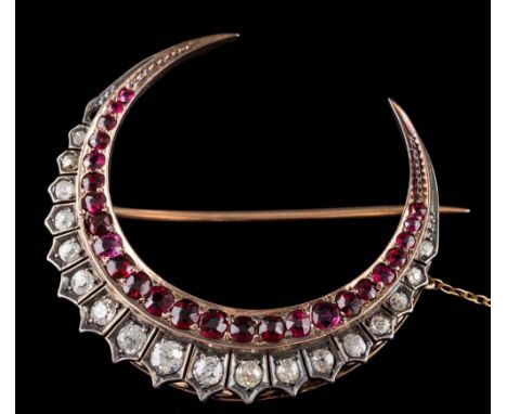 A 19th Century ruby and diamond crescent brooch: set with graduated round, old-cut diamonds and graduated rubies, total diamo