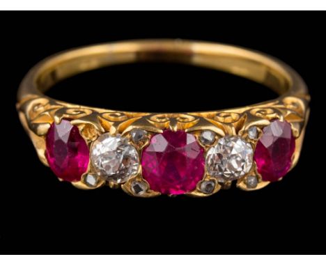 A ruby and diamond five-stone ring: with graduated, oval rubies and round old, brilliant-cut diamonds between diamond points,