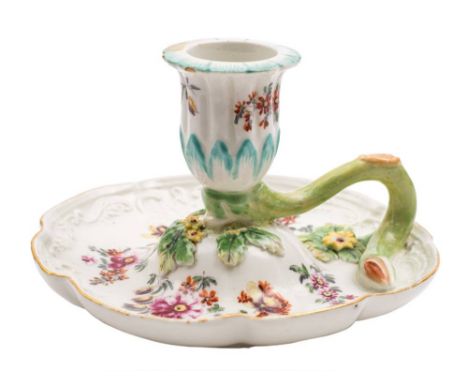 A Derby chamber candlestick: of shaped circular form with twig handle, moulded with scrollwork and foliage and painted in 'Co