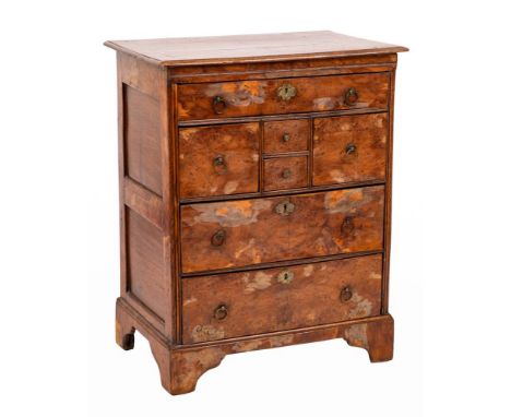 An 18th Century burr yew-wood and oak Norfolk chest:, the top with a moulded edge, fitted with a single long frieze drawer, t