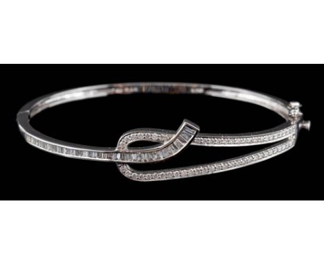 A modern diamond mounted hinged bangle: with small brilliant and baguette-cut diamonds estimated to weigh a total of 1.5cts, 