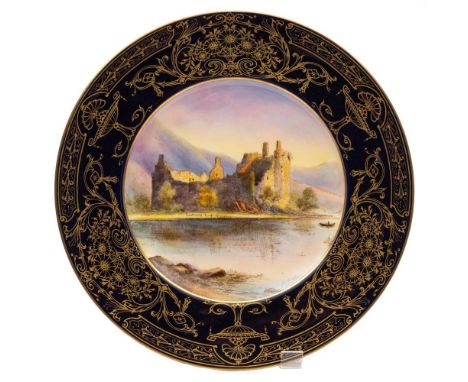 A Royal Worcester cabinet  plate: painted by Harry Ayrton with a view of Kilchurn Castle within a gilded deep blue border, si