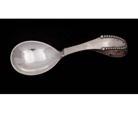A Georg Jensen silver Beaded pattern feeding spoon bears import marks for London, 1938: 11cm. long, 37gms, 1.21ozs.