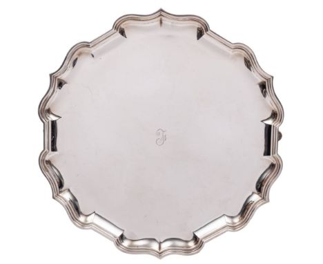 A George V silver salver , maker Hamilton &amp; Co, London, 1920: initialled, of circular outline with moulded scroll border,