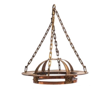 An Arts and Crafts copper light fitting: the circular corona suspended from rectangular linked chains, with arched strap work