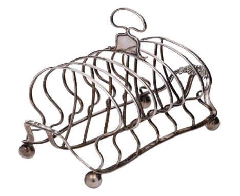 A George III silver six-division toast rack, maker William Bateman I, London, 1819: of rectangular outline, the arched cage w