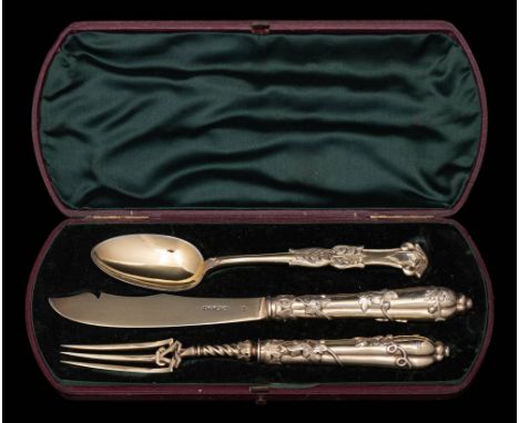 A Victorian silver-gilt three-piece christening set, maker H J Lias &amp; Son, London, 1851: crested, with foliate decorated 