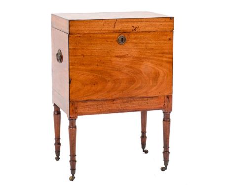 A Regency mahogany and inlaid rectangular cellarette:, bordered with ebony lines, the hinged top enclosing an interior fitted
