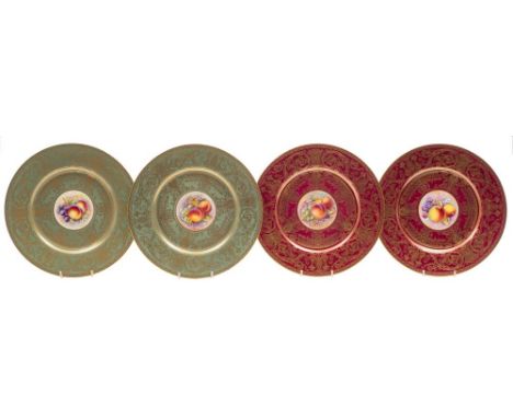 A pair of Royal Worcester cabinet plates and a similar pair the first pair painted with panels of peaches, grapes and blossom