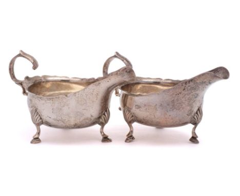 A pair of Victorian silver sauce boats, maker Charles Stuart Harris, London, 1888: crested, of traditional design with wavy e
