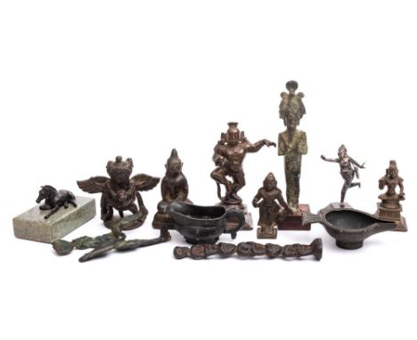 A collection of thirteen Egyptian, Indian and other bronze figures and jugs: various sizes 7cm -15cm.
