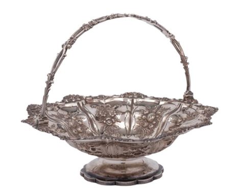 A William IV silver swing-handled basket, maker's mark worn, London, 1835: with embossed scroll and foliate decoration, with 