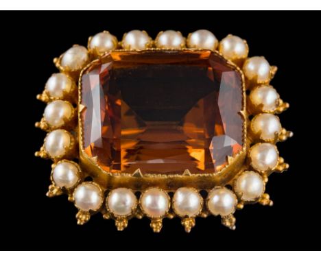 A citrine and split pearl mounted rectangular brooch: the rectangular citrine approximately 20mm long x 18mm wide x 11mm deep
